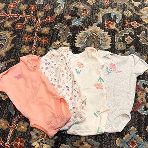 Set of Four Baby Onesies in Pink, Floral, and Gray